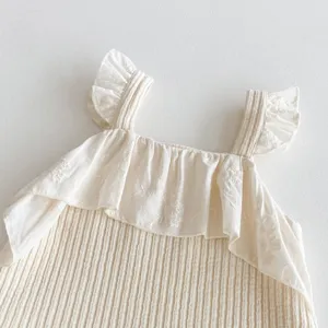 Infant baby ribbed cotton bodysuit detail, cute ruffle strap design for daily wear.