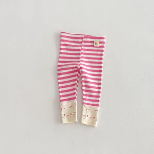 Pink white striped baby toddler leggings detail close up, cute cat face cuff design soft fabric.
