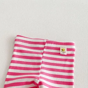 Close-up detail of pink and white striped baby leggings waistband with small brand label.