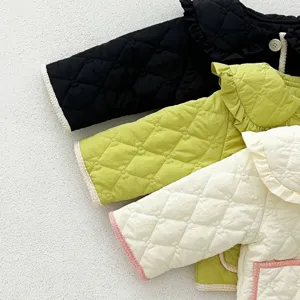 Baby girl winter fleece padded jacket, cute ruffled collar, quilted coat detail view.
