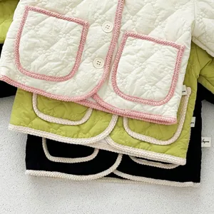 Baby quilted cotton coat detail shot, sweet style fleece-lined winter outerwear piece.