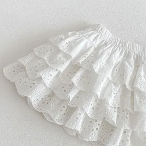 Infant white tiered ruffle skirt bloomer with delicate eyelet embroidery for sweet summer style.