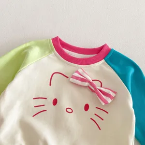 Toddler girl colorblock sweatshirt detailed view, cute bow design, comfortable knit fabric.