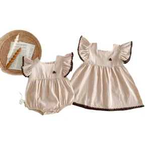 Infant baby summer romper and dress set in beige with cute brown pom-pom lace trim sweet design