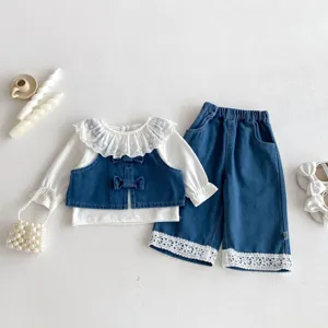 Toddler girl denim clothing set featuring white lace blouse and stylish trousers for spring.