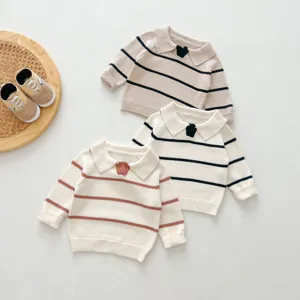 Detailed view of baby knitted sweaters with cute lapels and classic stripes design.
