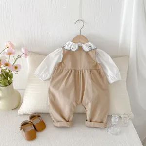 Infant baby clothing set detailed view showing the cute embroidered collar blouse and soft romper.