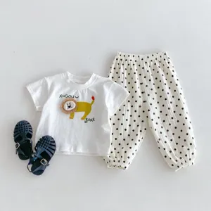 Infant summer short-sleeve T-shirt and polka dot pants set with cute lion graphic details.