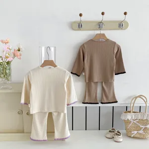 Adorable baby girl ribbed top and flare pants two-piece set, cute autumn toddler clothing.