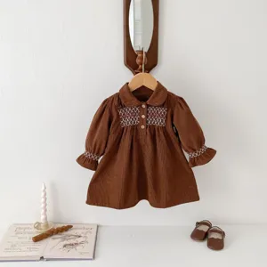 Baby girls brown corduroy dress with white embroidery, sweet autumn toddler clothing detail view
