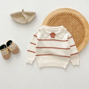 Infant knit sweater detail showing striped design, lapel collar, and matching toddler styling.