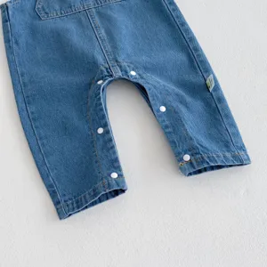 Baby denim overalls rompers detail shot with snap buttons and chest pocket design.