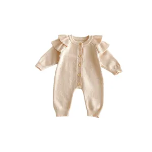 Cute newborn baby knitted romper with flying sleeves and wooden buttons for autumn winter wear.