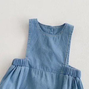 Infant baby light blue soft denim dress detail shot, breathable summer sleeveless toddler clothing.