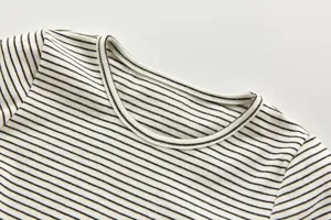 Baby black and white striped t-shirt detail, soft knit fabric, classic crew neck design.