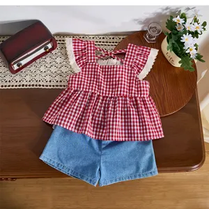 Details of toddler girl red plaid sleeveless top and denim shorts set flat lay scene