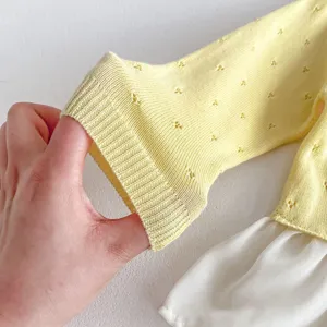 Baby girls summer knit cardigan detail, yellow hollow out fabric with white hem, cute toddler outerwear.