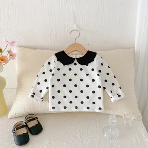 T-shirt à manches longues pour bébé fille avec col noir et motif à pois pour l'automne.