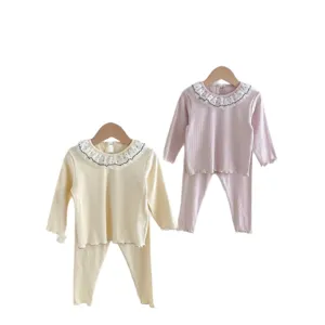 Cute baby toddler girl long sleeve ruffle collar top and leggings pajama set main view.