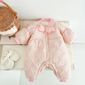 Infant winter quilted romper with cute bow and floral embroidery, warm and cozy baby jumpsuit.
