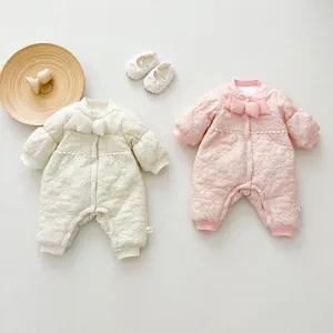 Cute quilted baby romper detail, fleece lined, bow accent, winter infant clothing.