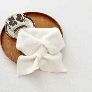 Detailed view of a cozy white plush and knitted winter scarf, soft texture, elegant design.