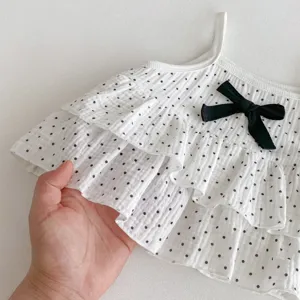 Sweet baby girls polka dot camisole with cute ruffles and black bow detail for autumn.