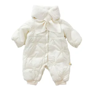 Cute winter baby girl off-white romper with plush collar bow and floral quilting design.