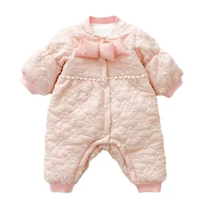Cute winter baby girl quilted romper with bow, thick fleece-lined infant jumpsuit outerwear.