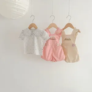 Set abbigliamento neonata stile coreano con camicia manica corta floreale e pantaloncini.