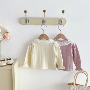 Infant baby girl knitted cardigan detail, cute lace collar, soft autumn toddler top apparel.