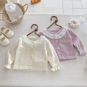 Infant baby girl knit cardigan sweater featuring delicate lace collar and ribbed texture.