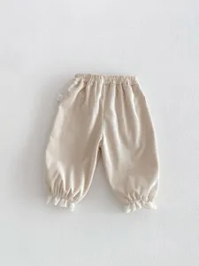 Korean style toddler girls corduroy pants with cute white lace trim cuffed ankles beige.