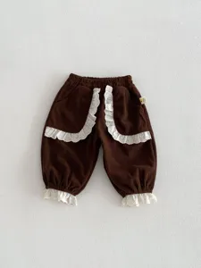 Korean style toddler girl spring corduroy pants with cute white lace ruffles and cuffed hem.