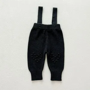 Infant dark grey knit suspender pants with cute knee heart texture details for daily wear.