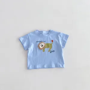 Close-up detail view of the adorable cartoon lion applique and print design on the infant t-shirt top.