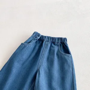 Kids blue denim jeans elastic waist and pocket detail shot for spring fashion outfits