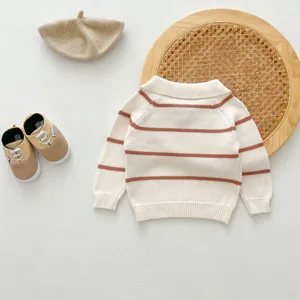 Infant striped knit sweater detail, cozy lapel collar design with soft autumn fabric.