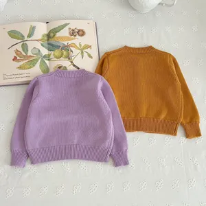Cute toddler children long sleeve knitted sweater pullover in purple and mustard yellow colors.