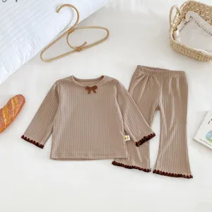 Toddler ribbed long sleeve top and flare pants set detail, cozy baby lounge set with bow accent.