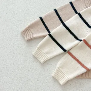 Baby knit sweater detail shot featuring soft fabric and striped long sleeves, ideal for autumn.