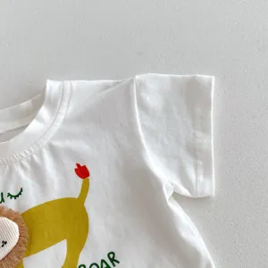 Detailed shot of infant white short-sleeve t-shirt with cute lion graphic and textured mane.