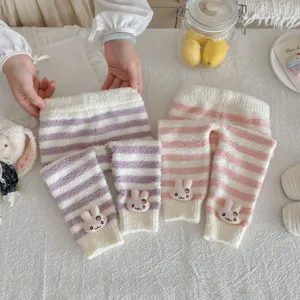 Cozy striped fuzzy baby lounge pants detail featuring cute 3d plush rabbit decor, soft wear.