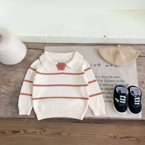 Baby knit sweater detail view, lapel collar with striped pattern, soft fabric for infants.