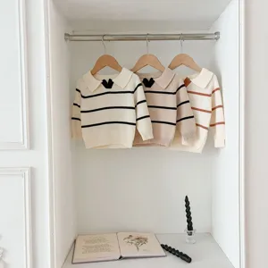 Knit sweater detail view, striped design with lapel collar, soft fabric for toddlers.