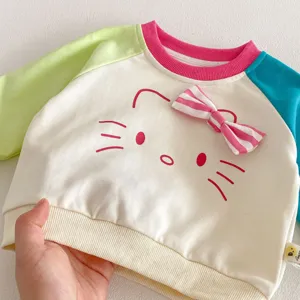 Cute baby girl color block sweatshirt with cat face print and sweet bow detail for spring.