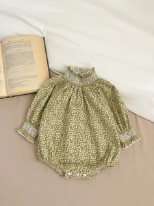 Baby floral long sleeve romper with ruffled collar, cozy vintage infant clothing detail view.