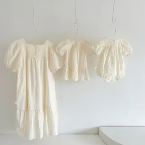 Korean style summer embroidered kids dress and baby romper detail view, cream white cotton.