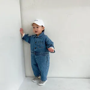 Infant baby denim jumpsuit long sleeve baby toddler workwear romper outwear detail view.