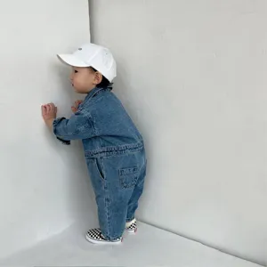 Cute baby denim jumpsuit with long sleeves and practical overalls design for infants.